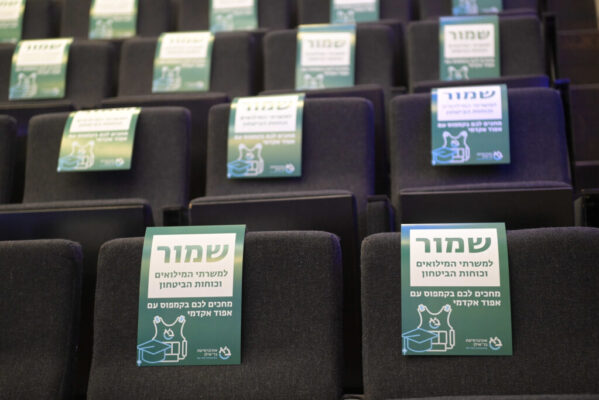 chairs in Assembly Hall with "reserved" note on theme