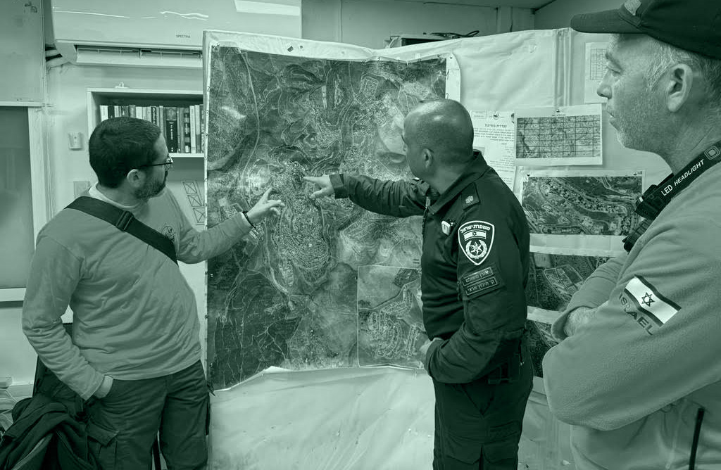 As the volunteer head of the Israeli police’s Northern Command, Dr. Alon Barash (far left) helps the search for a missing Ethiopian girl from Safed in March.