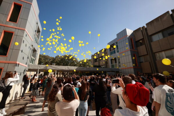 release of yellow balloons by students