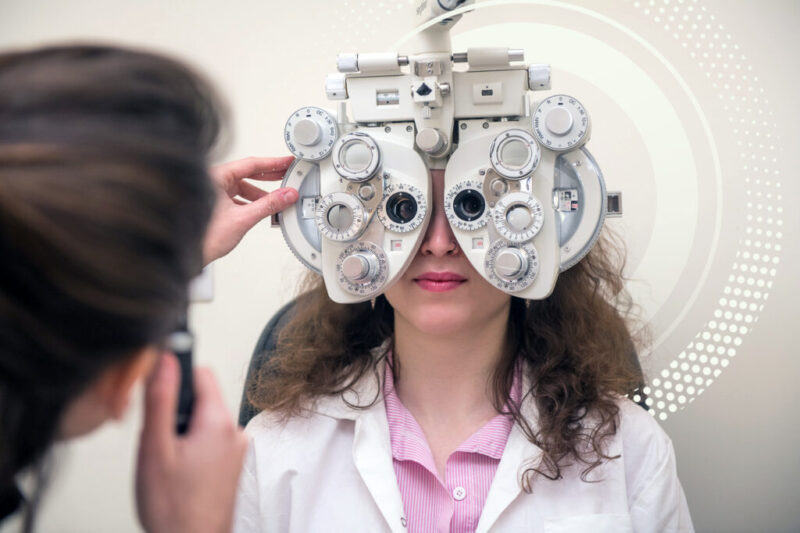 An optometry student with patient doing an Eye examination