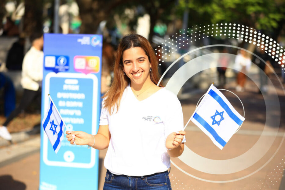 a student Smiling waving two Flags